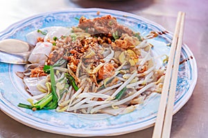 Appetizer dish of traditional Thai street food, Kuay Tiew Lui Suan, Fried Minced Pork and dried shrimp with Noodle Pad served with