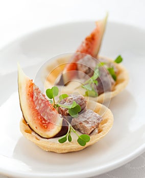 Appetizer with fig and pate photo