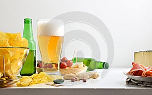 Appetizer with glass of beer and isolated background front view