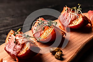 Appetizer Grilled peach with prosciutto, capers, microgreen, Food recipe background