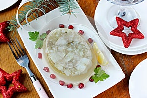 Appetizer of jellied fish on a festive table