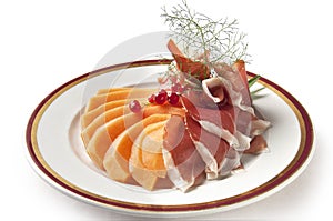 Appetizer Parma ham and melon with currants