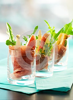 Appetizer with pear, prosciutto,arugula,gorgonzola photo