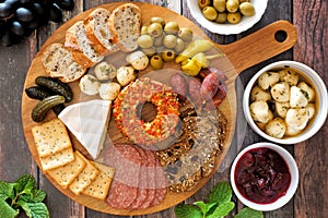 Appetizer platter above scene with a wood background
