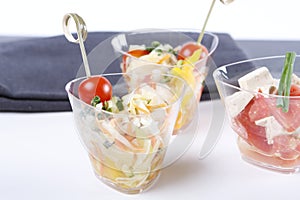 Appetizer salads in a small glass