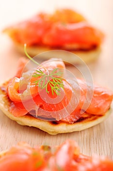Appetizer with salmon pancakes photo