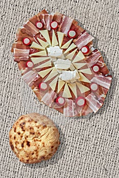 Appetizer Savory Dish Meze And Flatbread Pitta Loaf Set On Coarse Bleached Jute Canvas Grunge Surface