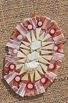 Appetizer Savory Dish Meze Garnished With Radish Red Bulbs Set On Coarse Jute Canvas Grunge Backdrop