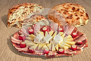 Appetizer Savory Dish Meze And Leavened Pitta Flatbread Loaves Set On Striped Brown Kraft Paper Background