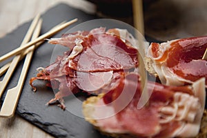 Appetizer Serrano ham with toasted bread