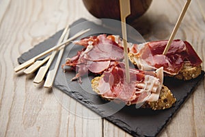 Appetizer Serrano ham with toasted bread