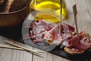 Appetizer Serrano ham with toasted bread