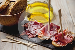 Appetizer Serrano ham with toasted bread