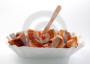 Appetizer of smoked sliced sausage