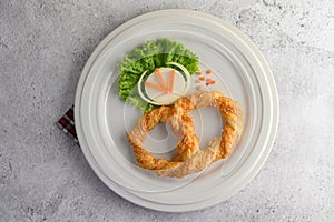 Appetizers of Pretzel on white dish
