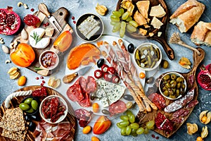 Appetizers table with antipasti snacks. Authentic traditional spanish tapas set, cheese and meat platter