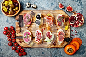 Appetizers table with italian antipasti snacks. Brushetta or authentic traditional spanish tapas set