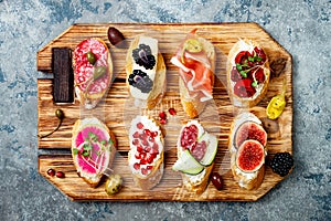 Appetizers table with italian antipasti snacks. Brushetta or authentic traditional spanish tapas set