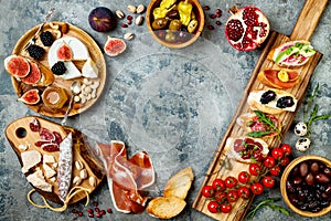 Appetizers table with italian antipasti snacks. Brushetta or authentic traditional spanish tapas set, cheese variety board