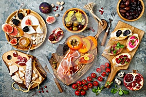 Appetizers table with italian antipasti snacks. Brushetta or authentic traditional spanish tapas set, cheese variety board