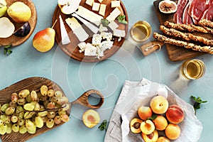 Appetizers table spanish tapas cheese variety fruits jamon Top view flat lay