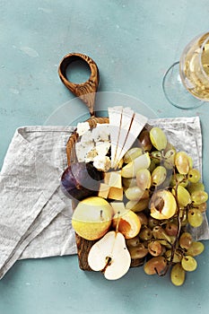 Appetizers table wine Fruit cheese wooden board background Wine appetizers