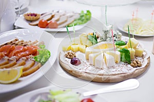 Appetizers. Various types of cheese, salami and prosciutto. Decorated table, buffet