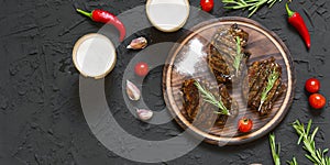 Appetizing beef steaks, beer and rosemary. top veiw