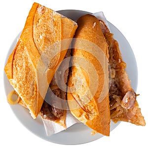 Appetizing bocadillos filled with chistorra sausages and caramelized onions photo