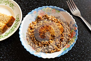 Appetizing buckwheat porridge with cutlet on plate. Healthy food. Russian cuisine