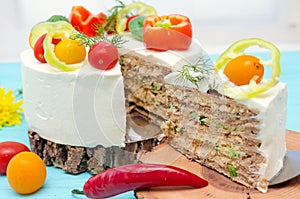 Appetizing cake with chicken meat, eggs and salad. Snack unsweetened cake