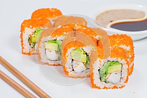 Appetizing California sushi rolls with rice, shrimps, avocado, c