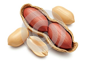Close up of fresh peanuts in shell with red kernels on white