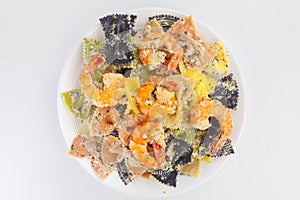 Appetizing colored farfalle pasta with chrimp photo