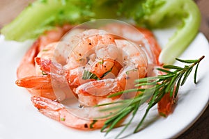 Appetizing cooked shrimps baked prawns , Seafood shelfish - Shrimp grilled delicious seasoning spices on white plate wooden