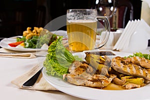 Appetizing Dishes and Beer Mug on Table