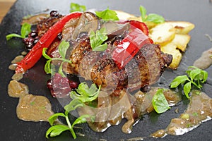 Appetizing food  loin  with vegetables and  boletus