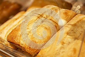Appetizing fresh baguettes on the counter in a store. Delicious traditional breakfast pastries. Close-up