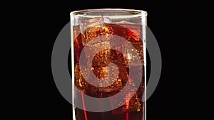 Appetizing fresh cola beverage with ice cubes and raising up air bubbles. 4k Dragon RED camera