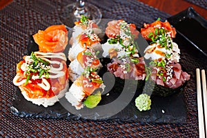 Gunkanmaki, uramaki and sashimi photo