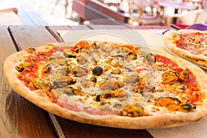 Appetizing italian seafood pizza. Delicious pizza with mussels
