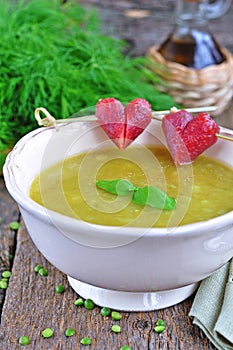 Appetizing pea soup with bacon and sausage