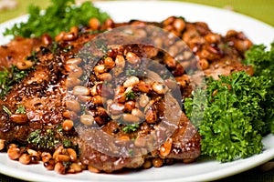 Appetizing pork chop with cedar nutlets