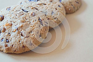 appetizing round cookies with nuts and chocolate for coffee on a brown background dessert sweet pastries traditional cui