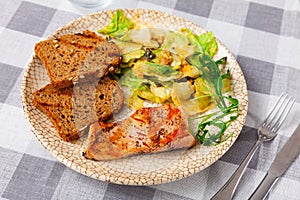 Appetizing salmon with a vegetable salad