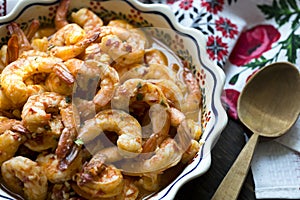 Appetizing shrimps cooked in spicy sauce with oil