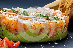 Appetizing smoked salmon tartare with avocado.