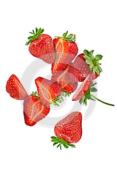 Appetizing strawberries whole, cut in half and sliced isolated on white background. Close up, copy space, top view