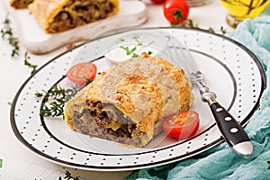 Appetizing strudel with minced beef, onions