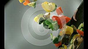 Appetizing vegetables fry in a frying pan.